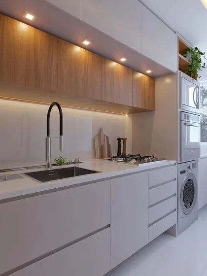 This view shows how a washing machine can be neatly integrated into the kitchen cabinetry. I always look for practical solutions to make the most of your available space.