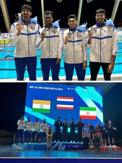 Aneesh Gowda and the Indian relay team with their silver medals.