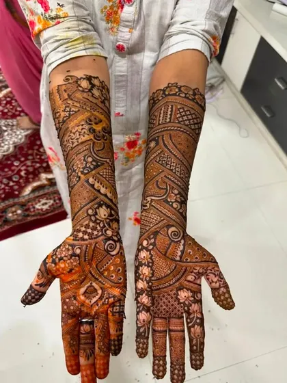 Another example of a beautiful, dark stain on a full bridal design. The contrast between the henna and the skin is stunning.