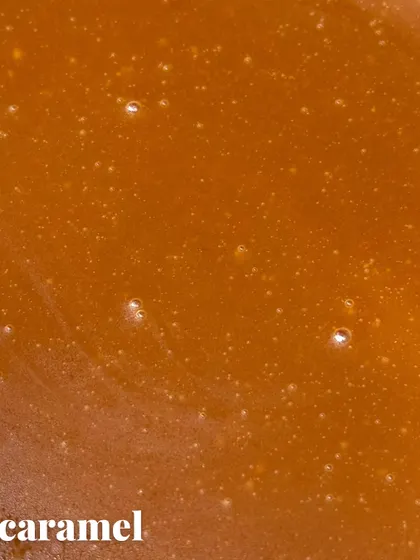 A close-up of our house-made liquid gold: the caramel. This layer adds a sweet, buttery richness that perfectly complements the cheesecake.