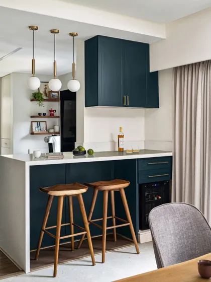 We turned a narrow passage into a stylish and functional bar counter and breakfast nook. This area features a wine cooler, extra storage, and comfortable seating, making it the perfect spot for a morning coffee or an evening drink.