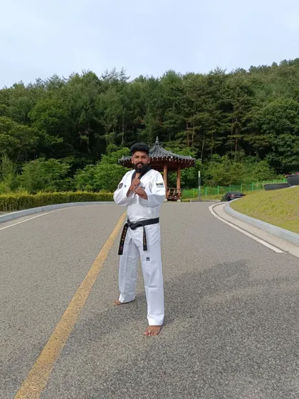 Practicing my stance on a quiet road in Muju, surrounded by nature. Taekwondo can be practiced anywhere.