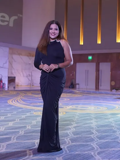 A full-length view of my stage attire for the Zenith Live conference, combining elegance with professional poise.