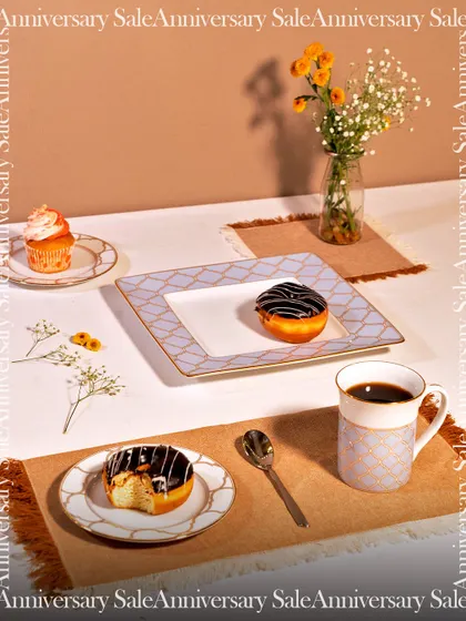 A beautifully styled breakfast scene featuring my Anardana collection. The delicate geometric patterns on the plates and mug add a layer of sophisticated design to your everyday dining experience.