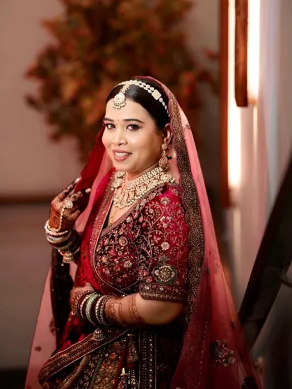 Another angle of this stunning red bride. The makeup is perfectly blended to look seamless, even in a close-up, candid shot.