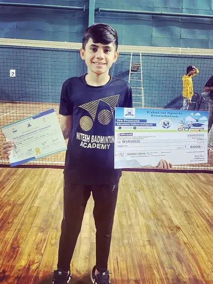One of my promising young players with his winner's certificate and prize from a local tournament. We nurture talent from the very beginning of their competitive journey.