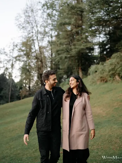 A quiet walk in the park. This shot of Harshit and Aayushi captures a simple, everyday moment of togetherness, showing that romance can be found in the most peaceful settings.