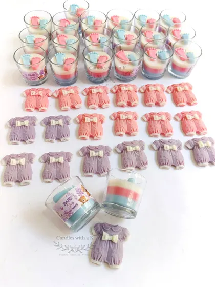 A different perspective of the baby shower order, showing the candles and sachets ready for boxing.