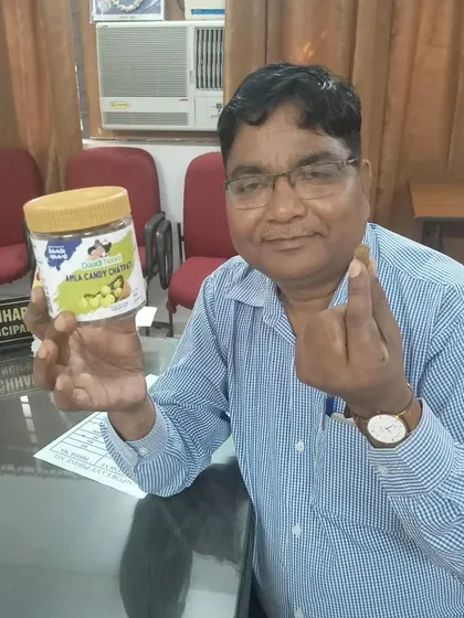 This gentleman is about to try a piece of our amla candy. It is heartening to see people of all ages appreciate the taste of home.