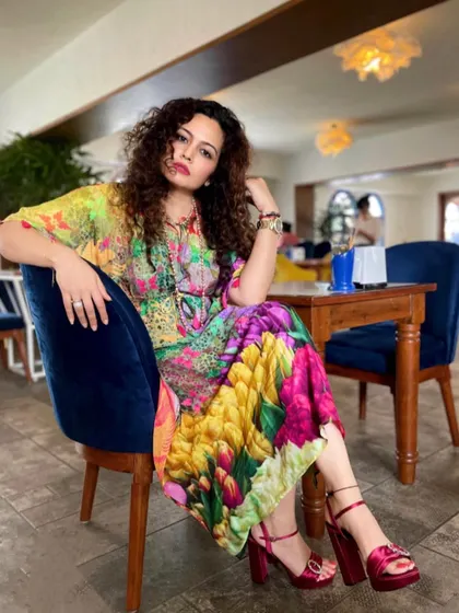My personal style is a reflection of my philosophy: fashion should be expressive and joyful. Wearing colors that make you feel vibrant is a form of self-care. I practice what I preach, using my own wardrobe to tell a story of confidence and creativity.
