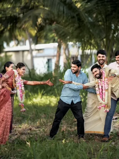 Another angle of the fun and games with the wedding party, showcasing the joyful atmosphere.