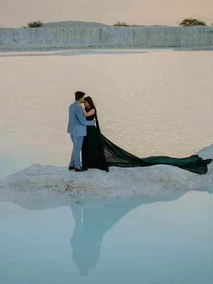 A romantic embrace on a small peninsula, with the couple's reflection creating a perfect mirror image. This is a great example of how I use the natural environment to create artistic shots.