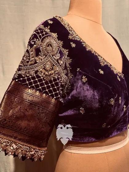 A stunning violet velvet and silk creation for the Mother of the Groom, with scalloped cut-edge work and jeweled buttas.