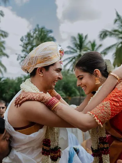 A candid moment of pure joy and affection during the wedding ceremony. It's these unposed, genuine interactions that truly tell the story of your love.