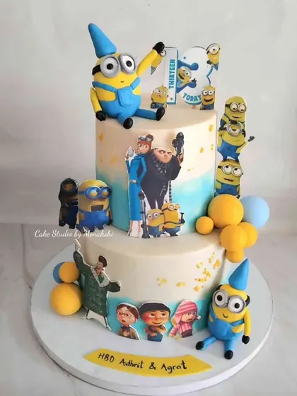 A fun-filled two-tier Minions cake I made for twins. The design is covered with the mischievous yellow characters from the Despicable Me movies, perfect for a shared celebration.