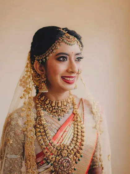 A radiant smile from the bride. Her custom blouse and traditional jewelry complete her stunning bridal look.