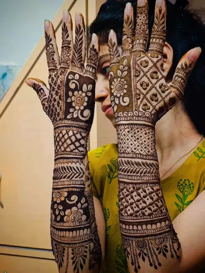 A beautiful and dense back-hand mehandi design. The patterns are a mix of traditional motifs that create a rich and elegant look.