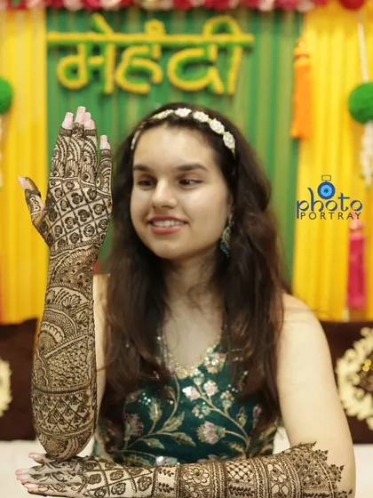 A full-arm shot showcasing the incredible detail of the bridal mehndi. We understand the importance of capturing this temporary art.