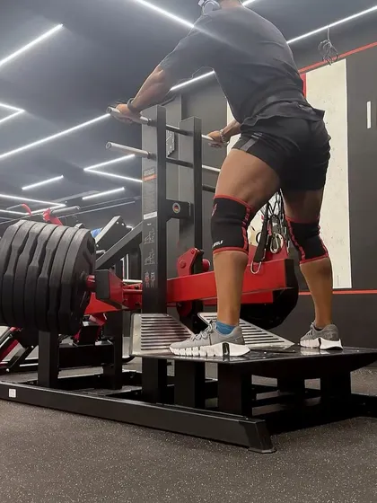 Loading up the belt squat machine for a heavy set. This exercise is excellent for overloading the legs without putting compressive force on the spine.