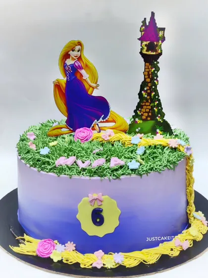 A simple, zero-fondant Rapunzel cake. I used buttercream piping to create her long, flowing hair and the grassy tower scene.