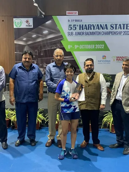 Nandini being formally recognized on stage for her championship win at the 55th Haryana State Sub-Junior Badminton Championship.