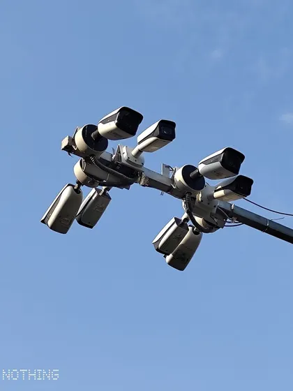 Another view of a multi-camera pole installation, designed for monitoring intersections or public spaces.
