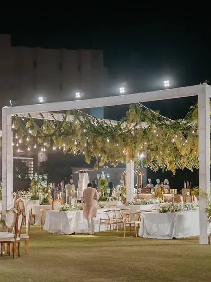 These images and videos provide wider views and different angles of the elegant 'Luxe Garden' reception, showcasing the scale and consistency of the design.