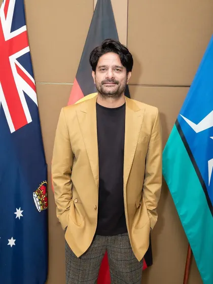 A sophisticated smart-casual look for Jaideep at an IFFM event. The tan blazer paired with plaid trousers is a classic combination with a modern twist.