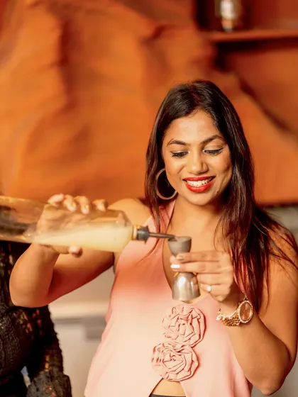 It's not just about the music, it's about the whole experience. A guest trying her hand at mixing a drink during our bar takeover segment.