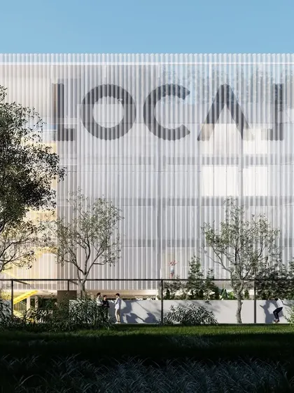Our co-living project in Whitefield, Bengaluru, features a transparent mesh facade with bold graphics. This screen provides privacy for residents while creating a strong visual identity for the building, which is designed to be a vibrant urban space.