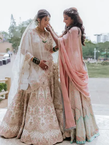 A sweet moment between sisters. I also did the sister's makeup, creating a cohesive but distinct look for her.