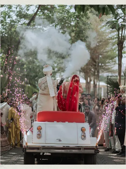A celebratory exit in a vintage car, complete with sparklers and smoke effects for a memorable farewell.