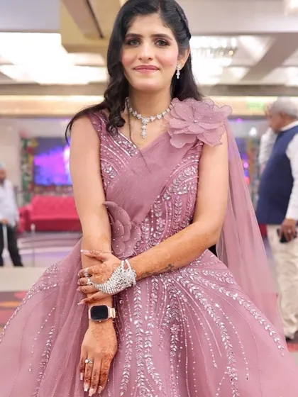 Another full-length shot of her beautiful pink outfit. She looks like a modern princess.