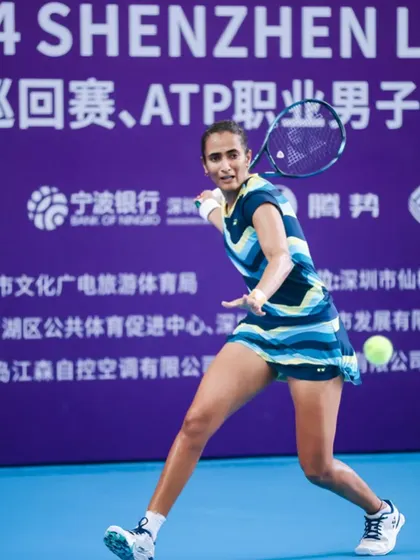 Rutuja covering the court with incredible speed and agility during a professional match.