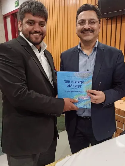Presenting a book to a fellow guest at the launch event attended by key figures from India's national security establishment.