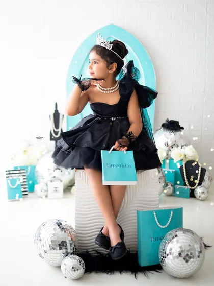 Posing with her shopping bag, this little girl looks like she just stepped off a runway.