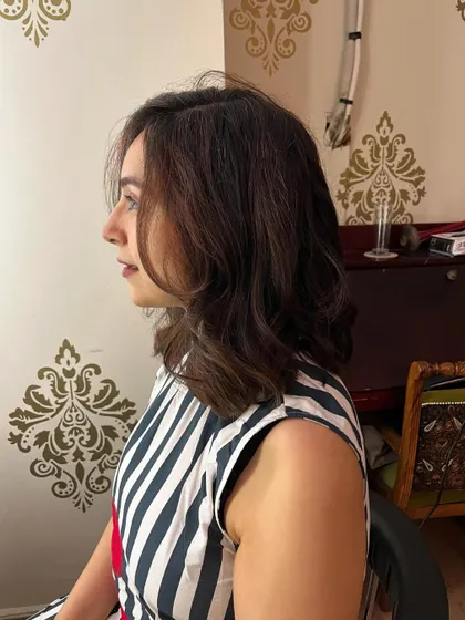 Subtle copper highlights and a long bob for Komal.