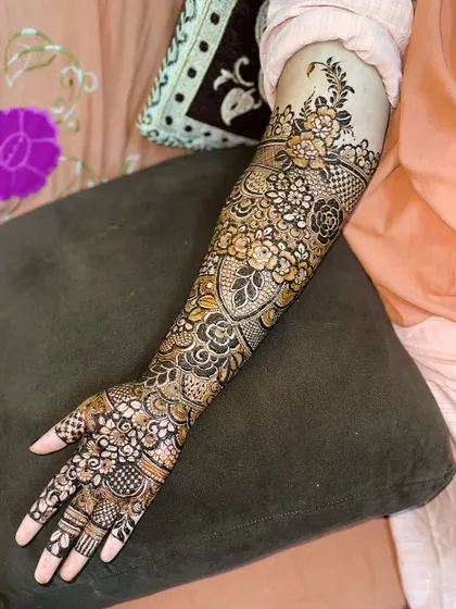 A full-arm view of the heart-gap floral design, showing how the pattern flows beautifully from wrist to elbow.