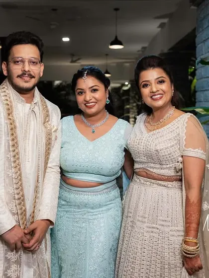 Ashwini with her sister and husband at her Sangeet. My senior artists created a beautiful look for her sister to complement the event's style.