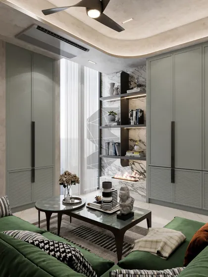 This view of the entertainment room showcases the ample storage integrated into the design. The sage green cabinetry and open shelving with a marble back provide a stylish and functional solution.
