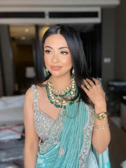 A portrait of pure elegance. The makeup enhances her features while maintaining a soft and romantic feel.