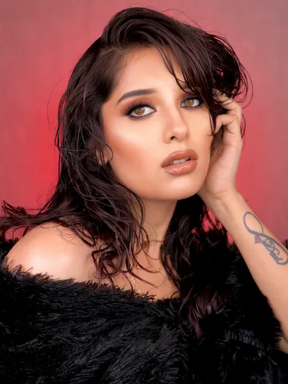 Inspired by a warm latte, this editorial makeup look features earthy tones, glossy lips, and a wet-hair look for a sultry, high-fashion feel.