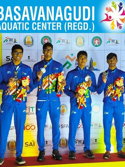 The men's 4x100m Medley relay team with their silver medals.