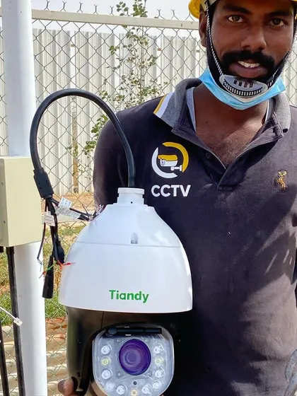 A close-up of the Tiandy PTZ camera after installation, showing the wiring neatly connected into a junction box.