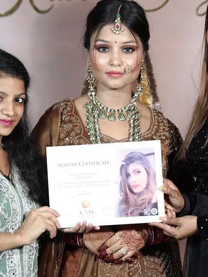 A proud moment for this student, receiving her Master Certificate after creating a stunning final look.