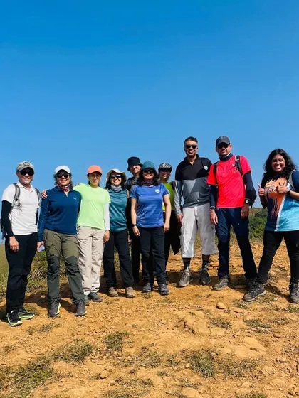A group of seasoned trekkers posing on the trail. We are proud to have a community of adventurers who return to explore new peaks with us.