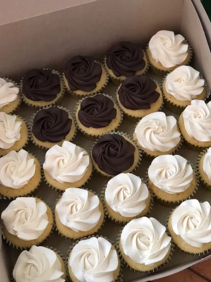 A mixed box of chocolate and vanilla cupcakes, perfect for pleasing every palate.