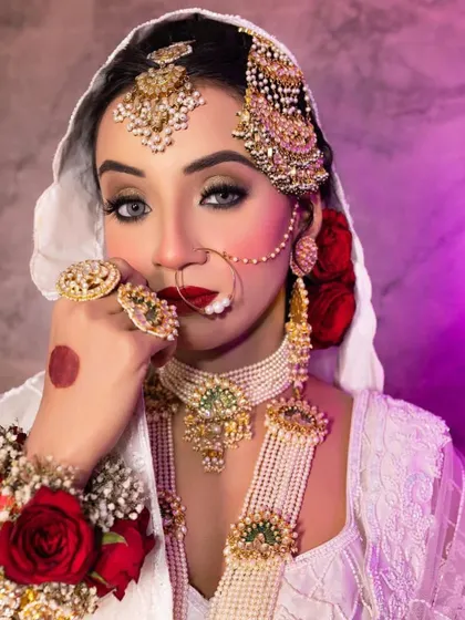 We have great offers running, so hurry up and contact us now. This stunning Nikkah look with bold red lips and dramatic jewelry could be yours.