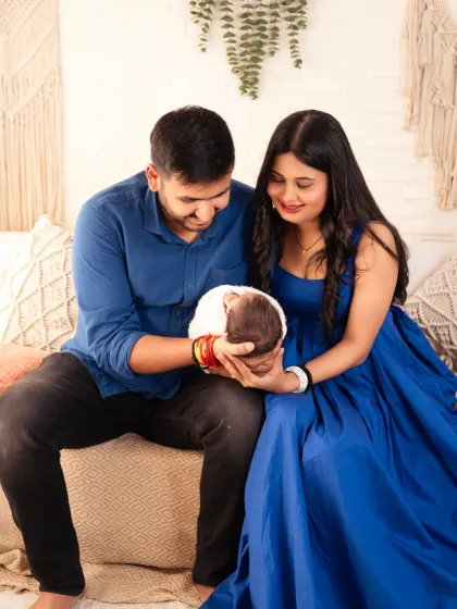 New parents admiring their precious newborn baby. These are the quiet, intimate moments we love to photograph.