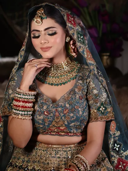 A close-up shot with eyes closed to showcase the detailed and perfectly blended eyeshadow work.